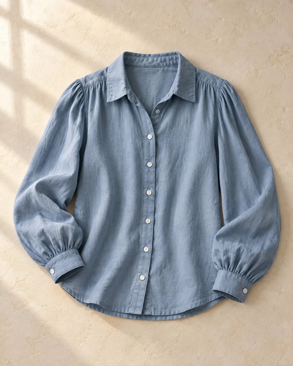 A sharp peek of the blue blouse fabric