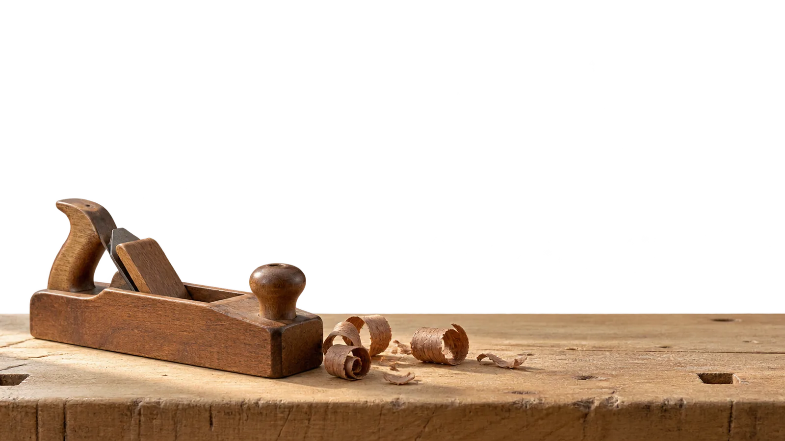A hand plane on the foreground bench